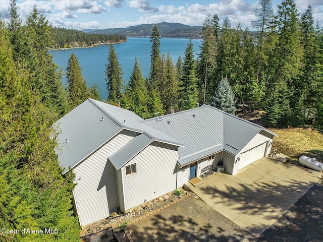 19820 S Alcan Rd, Coeur Dalene, ID 83814 - aerial view of property and surrounding area with a water and mountain view and a heavily wooded area