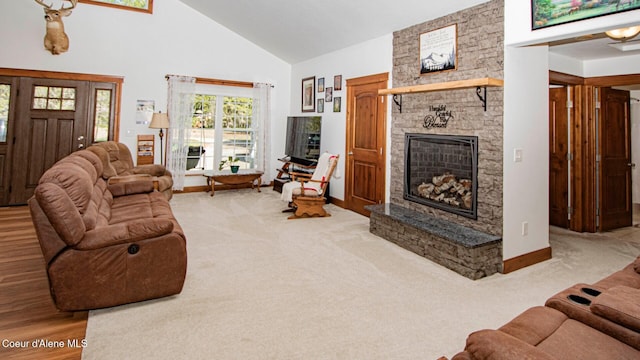 living room with carpet flooring, high vaulted ceiling, baseboards, and a fireplace