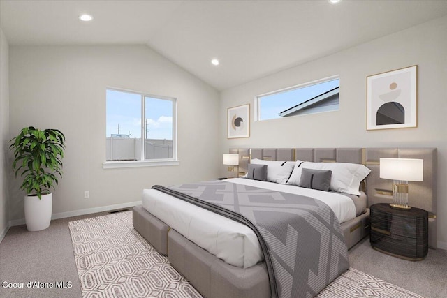 bedroom featuring baseboards, carpet, vaulted ceiling, and multiple windows