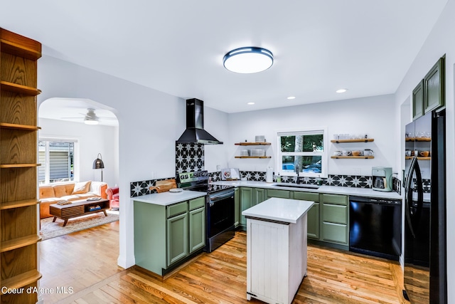 822 E Wallace Ave, Coeur Dalene, ID 83814 - kitchen featuring open shelves, green cabinetry, wall chimney exhaust hood, a sink, and black appliances