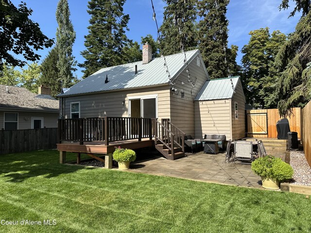 822 E Wallace Ave, Coeur Dalene, ID 83814 - rear view of property with a fenced backyard, outdoor lounge area, a patio area, and a deck
