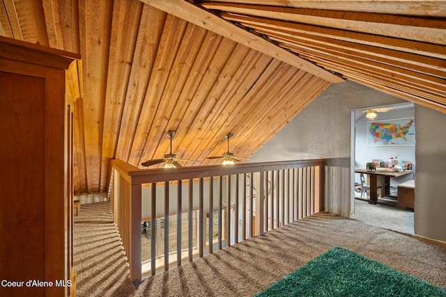 additional living space featuring a ceiling fan, carpet, and vaulted ceiling