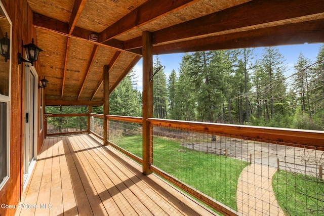 wooden deck with a yard