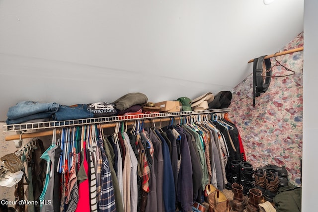 walk in closet featuring vaulted ceiling