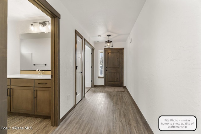 LT7BLK1 E Valley St, Oldtown, ID 83822 - corridor with a sink, baseboards, and light wood-style floors