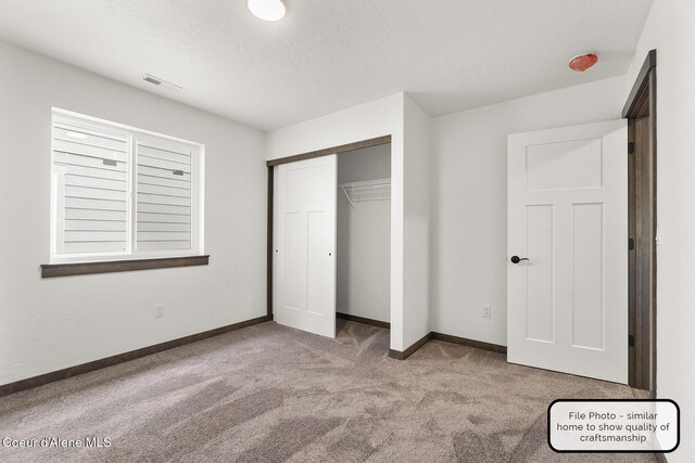 LT7BLK1 E Valley St, Oldtown, ID 83822 - unfurnished bedroom featuring baseboards, carpet, a closet, and visible vents