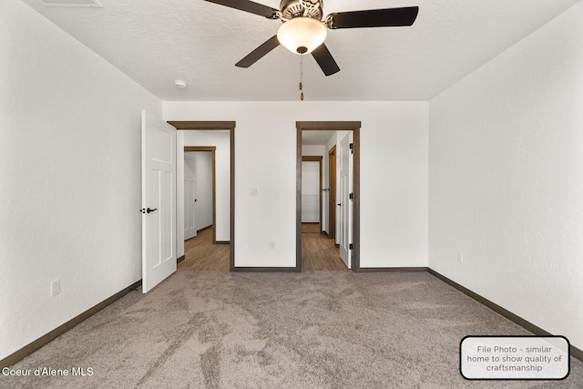 LT7BLK1 E Valley St, Oldtown, ID 83822 - unfurnished bedroom with baseboards, carpet flooring, and a ceiling fan