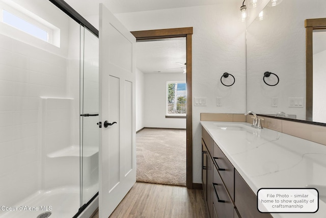 LT7BLK1 E Valley St, Oldtown, ID 83822 - bathroom with vanity, baseboards, wood finished floors, and a shower stall