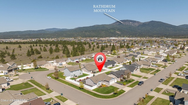 aerial view featuring a mountain view and a residential view