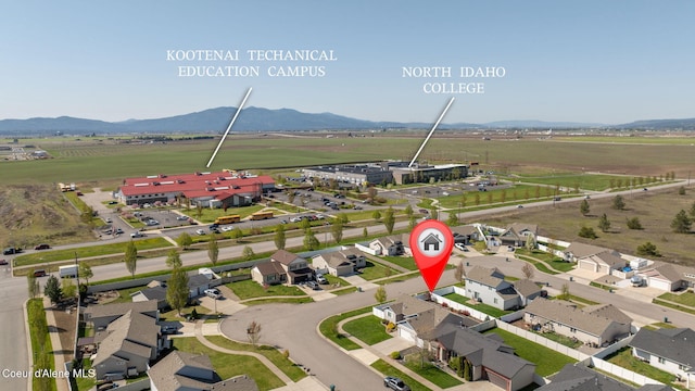 birds eye view of property featuring a mountain view