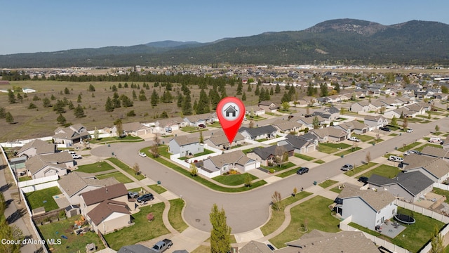 drone / aerial view with a mountain view and a residential view
