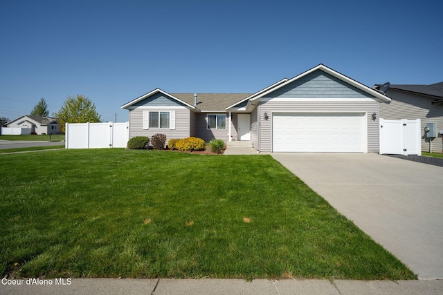ranch-style house with a garage, fence, concrete driveway, and a front yard