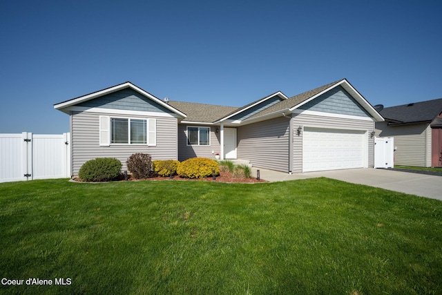 single story home featuring fence, a garage, a front yard, a gate, and driveway