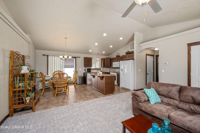 living room with recessed lighting, arched walkways, ceiling fan with notable chandelier, and lofted ceiling