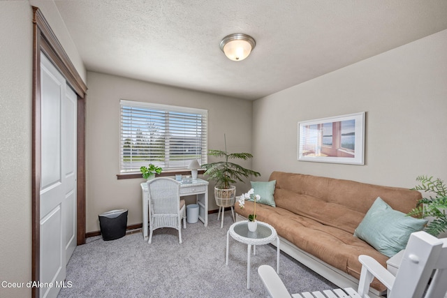 carpeted living room featuring baseboards