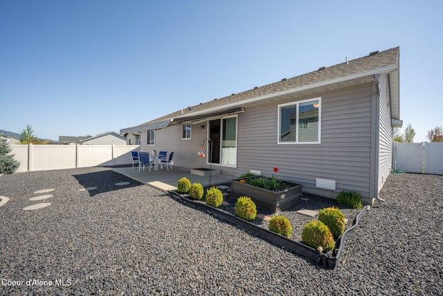 back of house with a patio and a fenced backyard