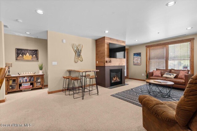 834 Mckinley Ave Unit 208, Kellogg, ID 83837 - living room featuring carpet flooring, baseboards, a large fireplace, and recessed lighting