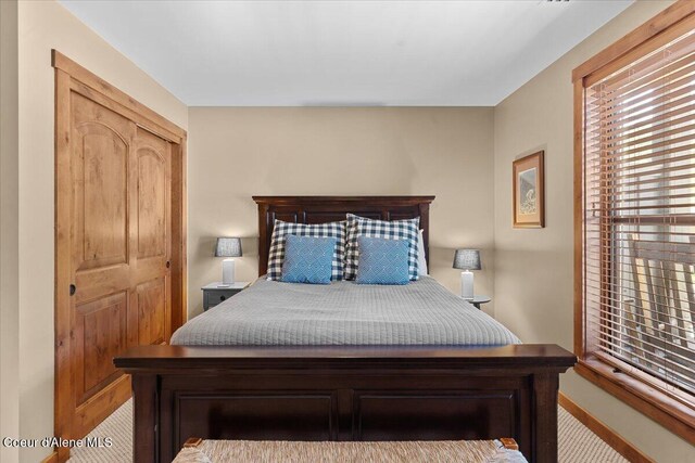834 Mckinley Ave Unit 208, Kellogg, ID 83837 - bedroom featuring baseboards and carpet flooring