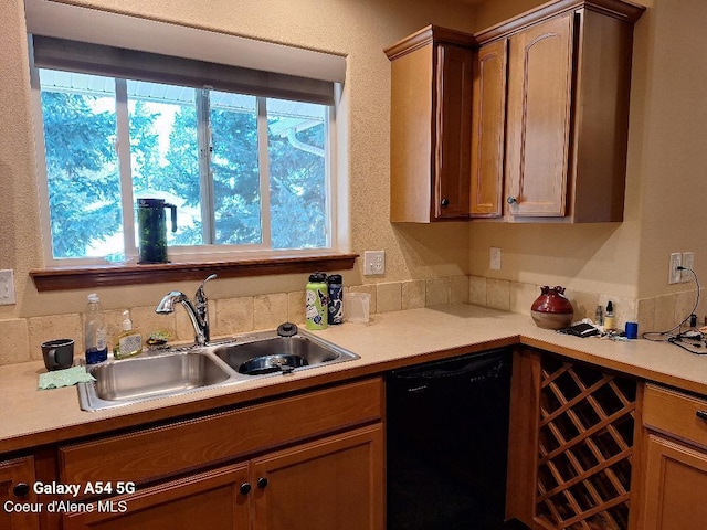 368 E Whispering Pines Ln # 6, Coeur Dalene, ID 83815 - kitchen with a sink, light countertops, and black dishwasher