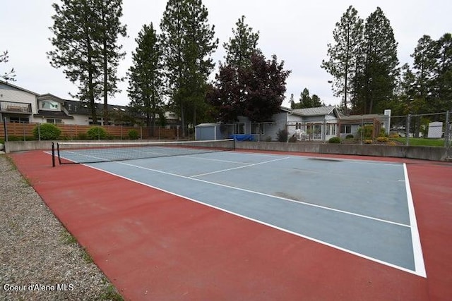 368 E Whispering Pines Ln # 6, Coeur Dalene, ID 83815 - view of tennis court with fence and community basketball court
