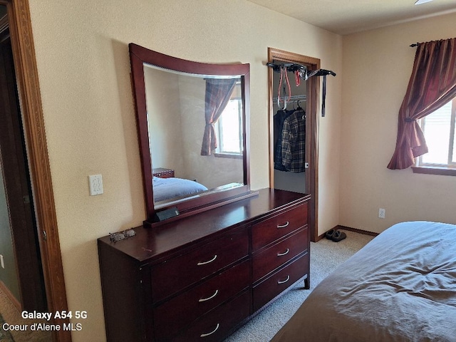 368 E Whispering Pines Ln # 6, Coeur Dalene, ID 83815 - bedroom featuring baseboards and light colored carpet