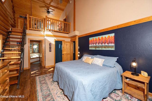 bedroom with baseboards, high vaulted ceiling, wood ceiling, and wood finished floors