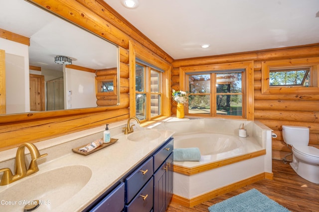 full bath with toilet, log walls, a sink, and wood finished floors
