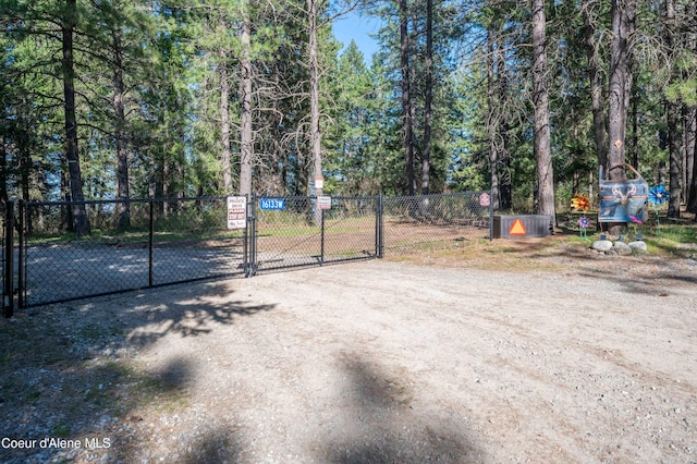 view of gate with fence