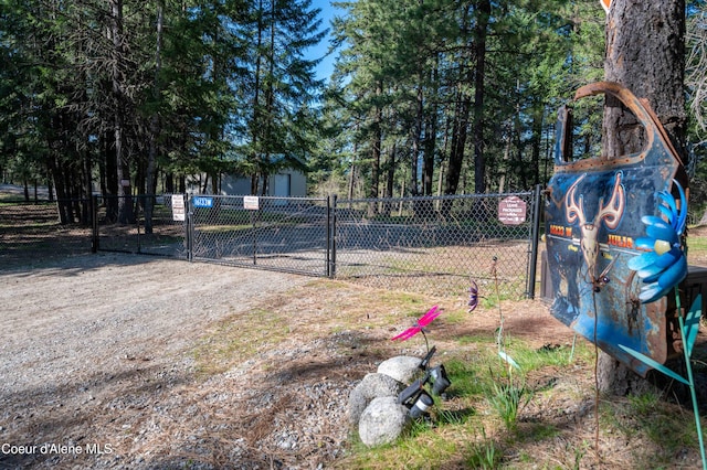view of yard featuring fence and a gate