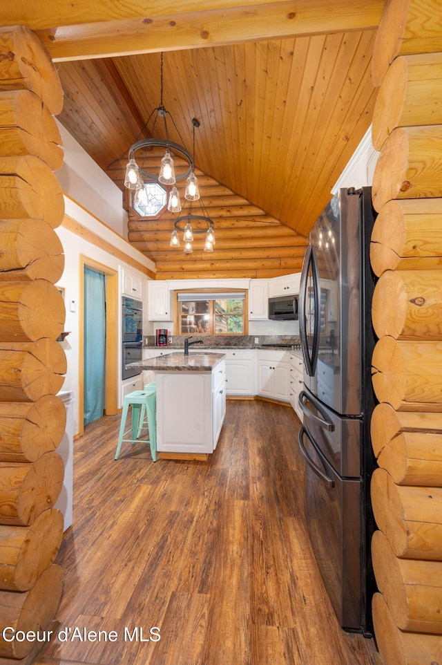 kitchen featuring black appliances, dark wood finished floors, wooden ceiling, white cabinets, and a notable chandelier