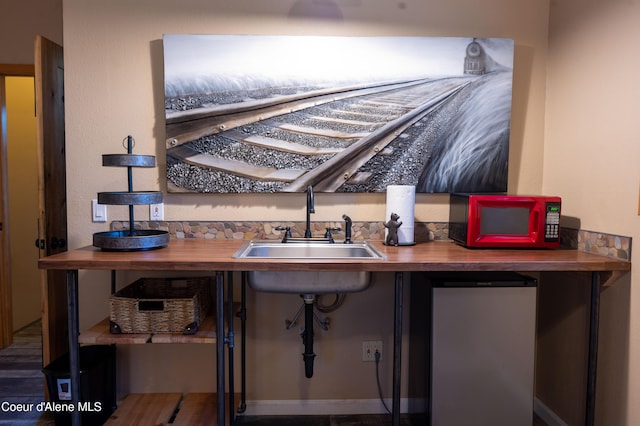 bar with a sink and fridge