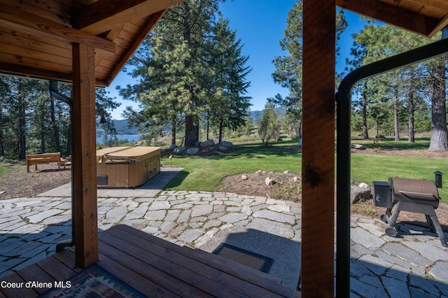 view of patio with a hot tub