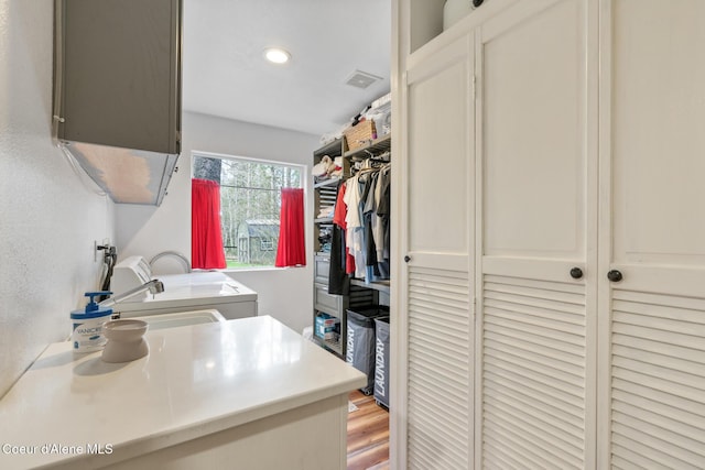 washroom featuring laundry area, recessed lighting, and visible vents
