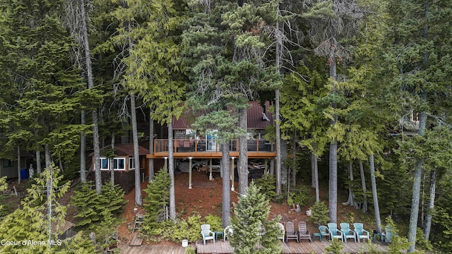 back of house with a deck