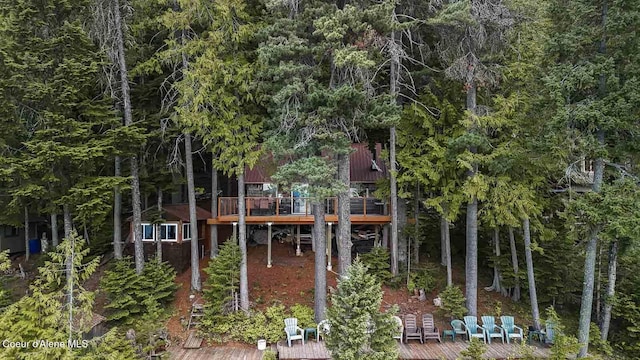 back of property featuring a deck