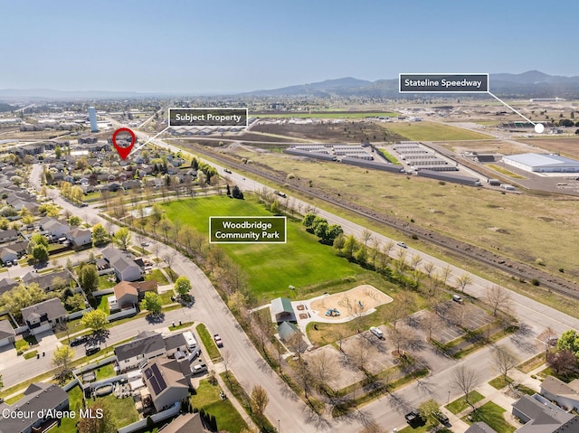 drone / aerial view featuring a mountain view
