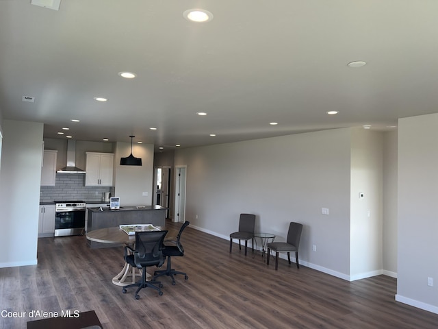 dining space with baseboards, recessed lighting, and dark wood-type flooring