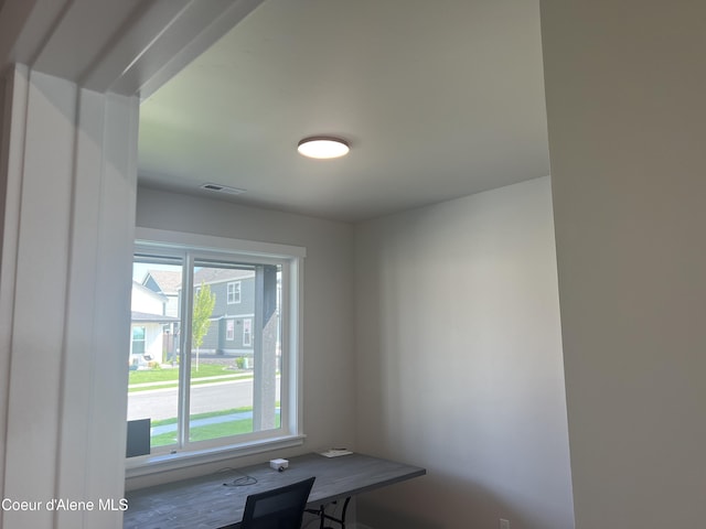 unfurnished dining area featuring plenty of natural light and visible vents