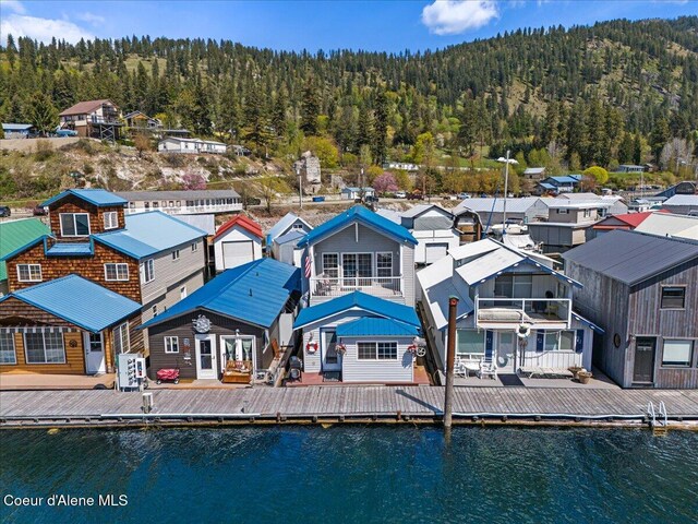 34128 N Scenic Bay D Dock Unit 21, Bayview, ID 83803 - back of house featuring a water view, a view of trees, and a residential view