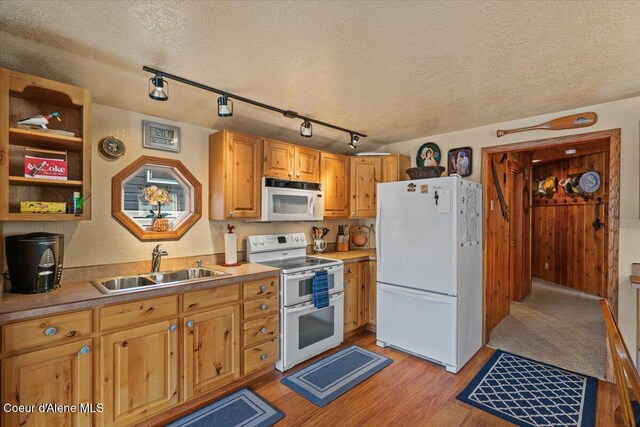 34128 N Scenic Bay D Dock Unit 21, Bayview, ID 83803 - kitchen with a sink, a textured ceiling, white appliances, and light wood-style flooring
