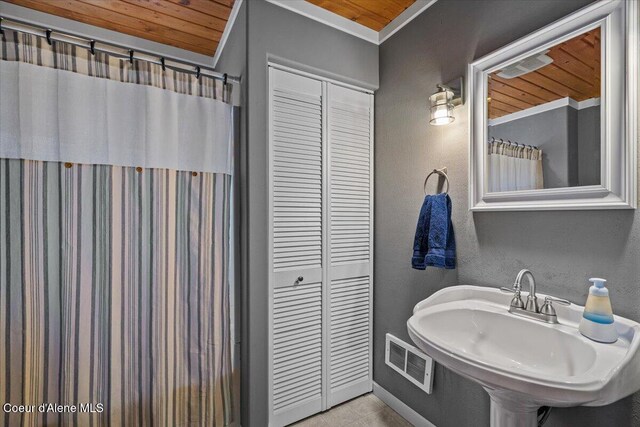 34128 N Scenic Bay D Dock Unit 21, Bayview, ID 83803 - full bath featuring visible vents, crown molding, baseboards, tile patterned floors, and a sink