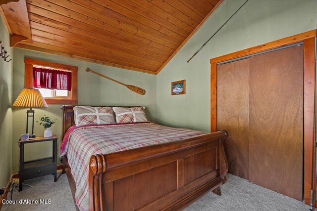 34128 N Scenic Bay D Dock Unit 21, Bayview, ID 83803 - carpeted bedroom featuring vaulted ceiling, wooden ceiling, and a closet