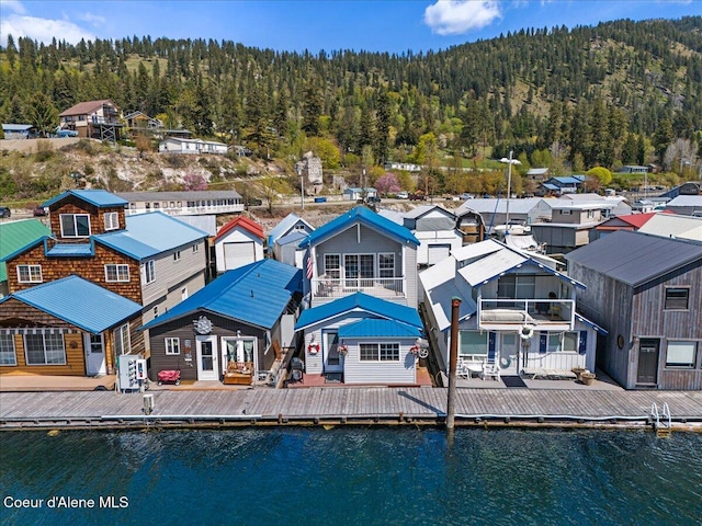 34128 N Scenic Bay D Dock Unit 21, Bayview, ID 83803 - back of house featuring a water view, a view of trees, and a residential view