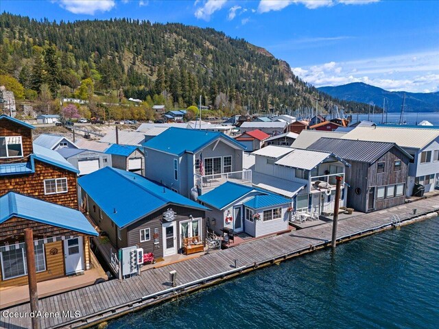 34128 N Scenic Bay D Dock Unit 21, Bayview, ID 83803 - back of house with a water and mountain view, a view of trees, and a residential view