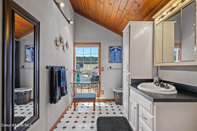 34128 N Scenic Bay D Dock Unit 21, Bayview, ID 83803 - full bathroom with vanity, lofted ceiling, baseboards, wood ceiling, and tile patterned floors