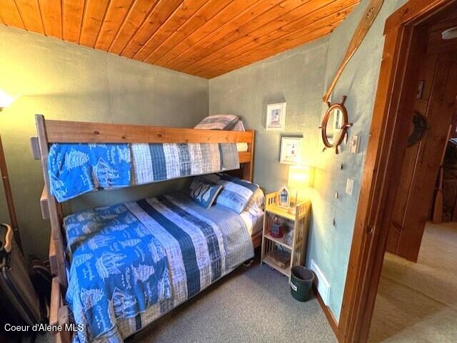 34128 N Scenic Bay D Dock Unit 21, Bayview, ID 83803 - bedroom featuring wooden ceiling and carpet