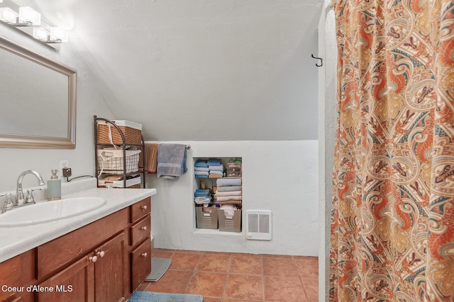 full bath with vanity, curtained shower, vaulted ceiling, tile patterned flooring, and heating unit