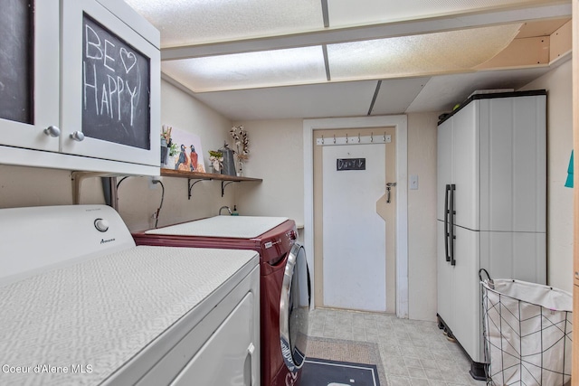 laundry area featuring cabinet space and washer and dryer