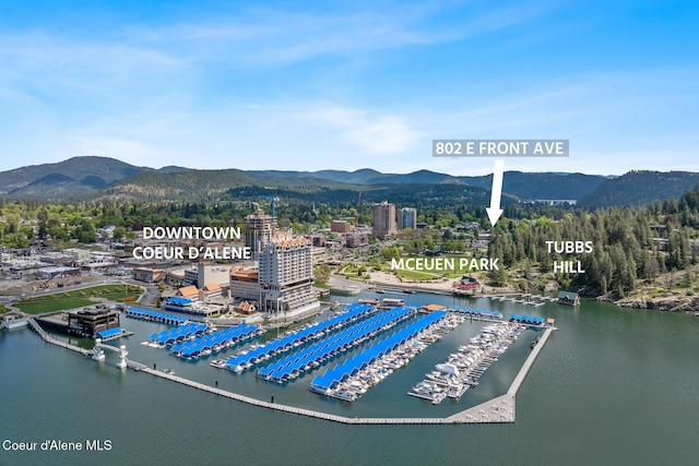 aerial view featuring a water and mountain view