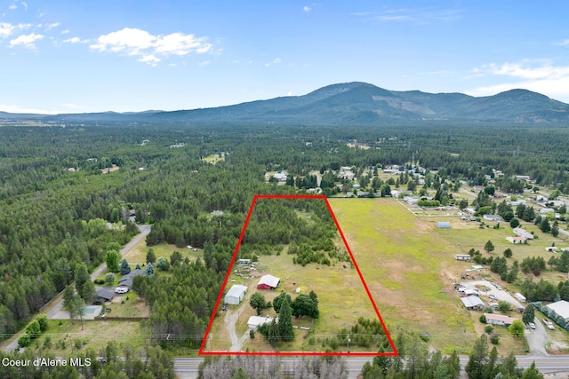 17871 N Ramsey Rd, Rathdrum, ID 83858 - aerial overview of property's location with a mountain backdrop and property parcel outlined